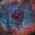 Rosette Nebula lies 5,000 ly away in the constellation Monoceros. It is a faint nebula glowing at magnitude 9.0 and emitting light in the HII region. 